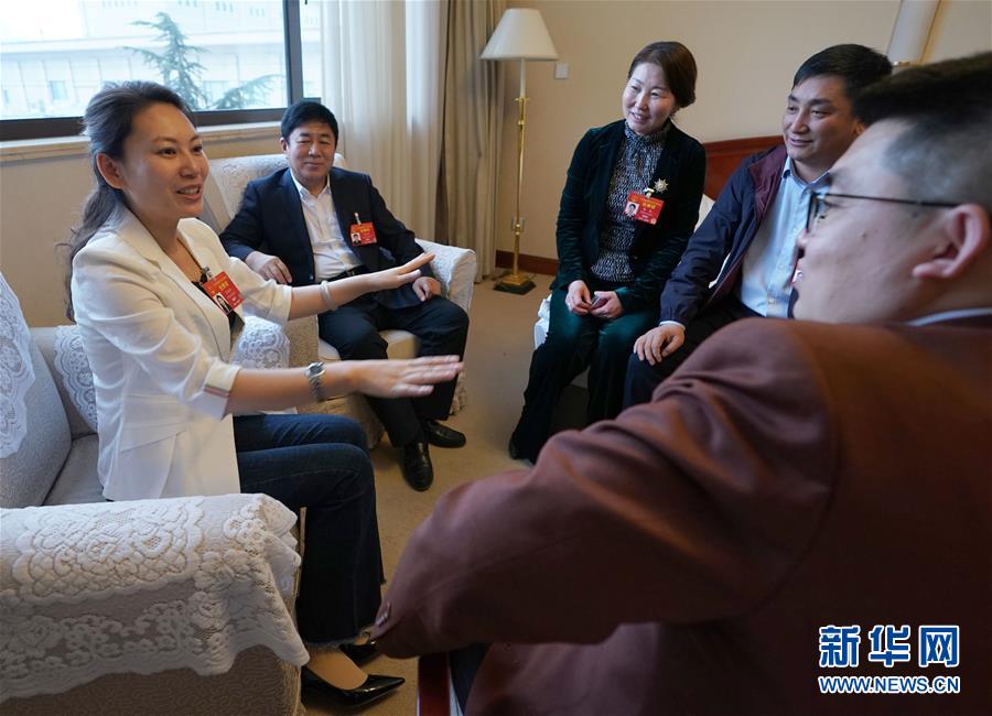 (兩會·圖片故事)(4)全國人大代表王欣會:讓自閉癥兒童融入社會生活